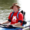Justin in his kayak wearing his St. Mark's T-shirt